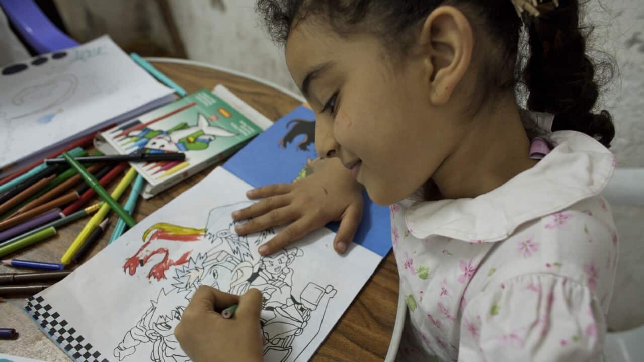 Representational image of a girl draws images during a drawing contest.
