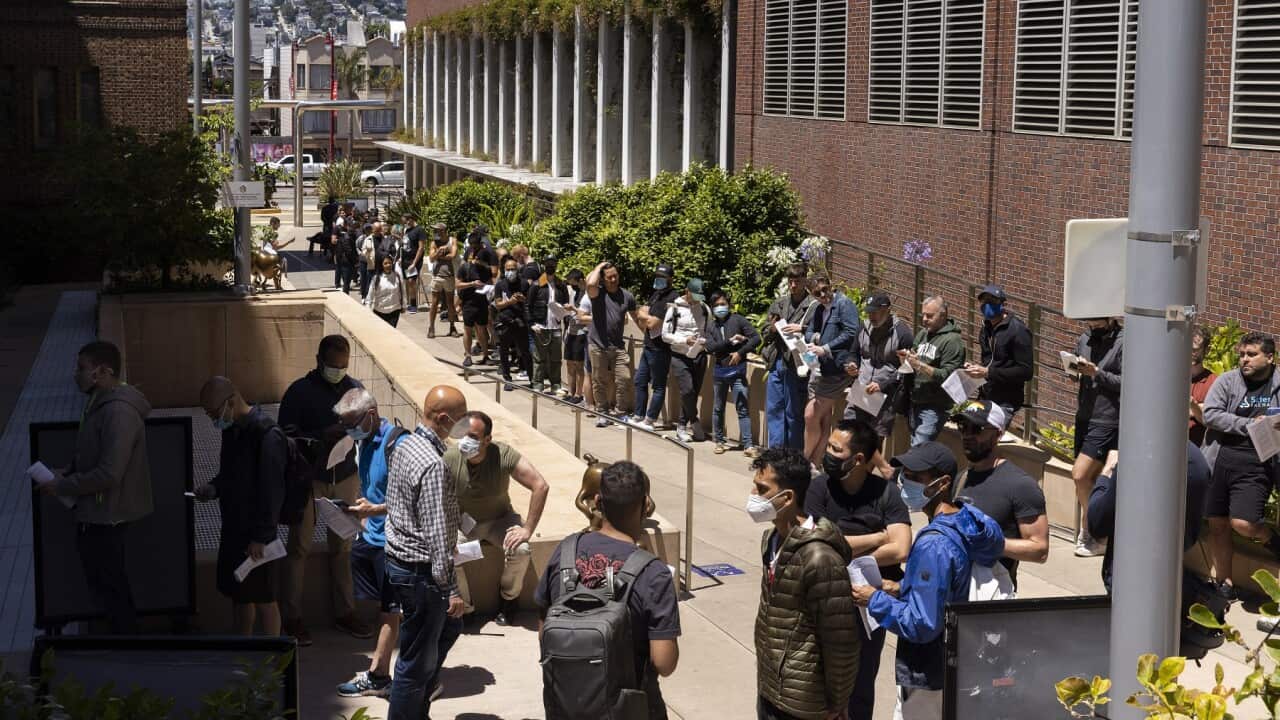 People stand in long lines to receive the monkeypox vaccine