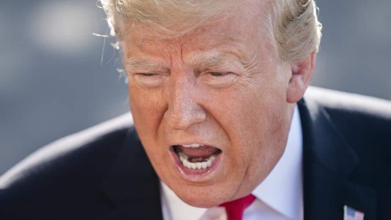 Donald Trump speaking to reporters at the White House