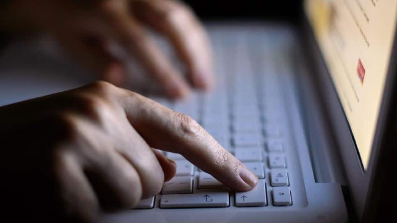 Fingers using laptop keyboard