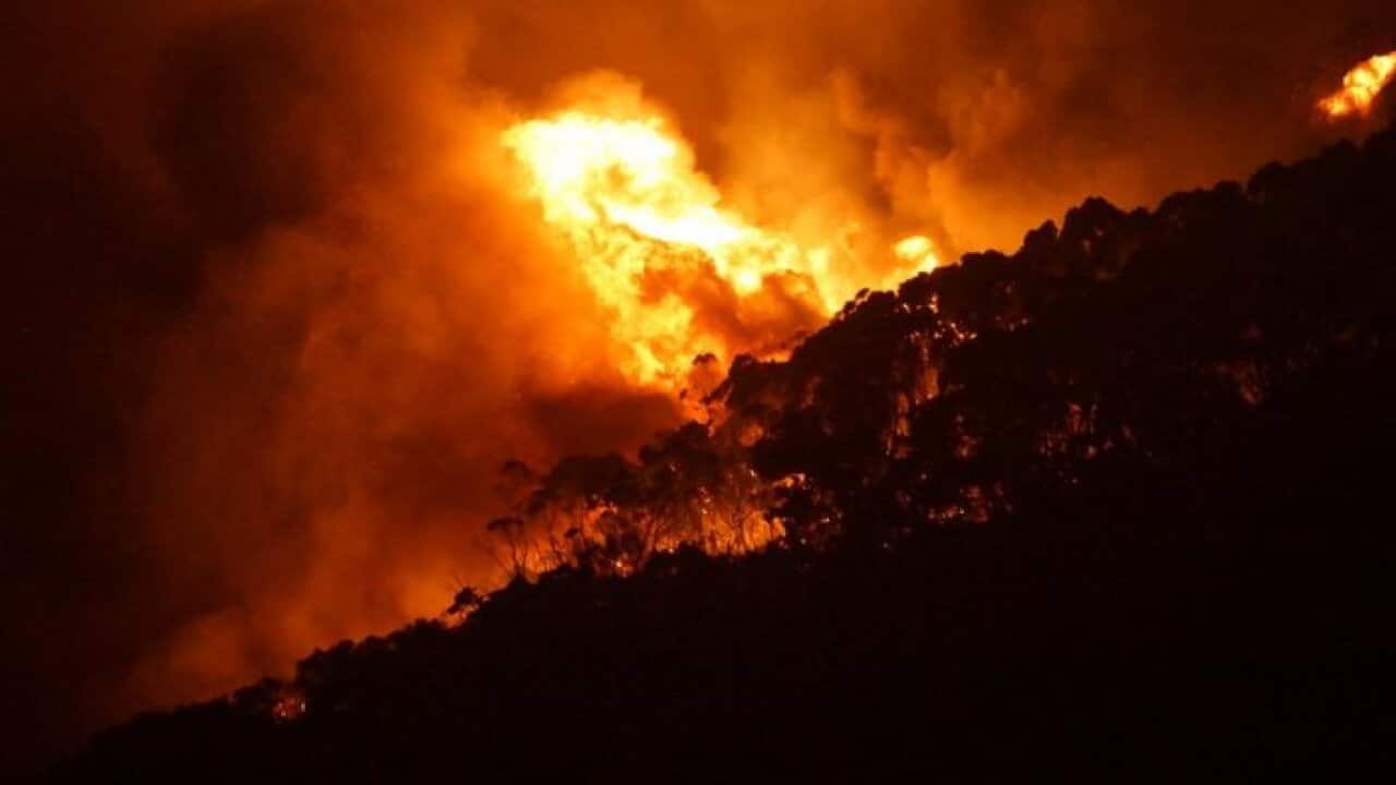 A supplied image obtained, Saturday, Dec. 26, 2015 of a bushfire at Wye River near Lorne south of in Melbourne.
