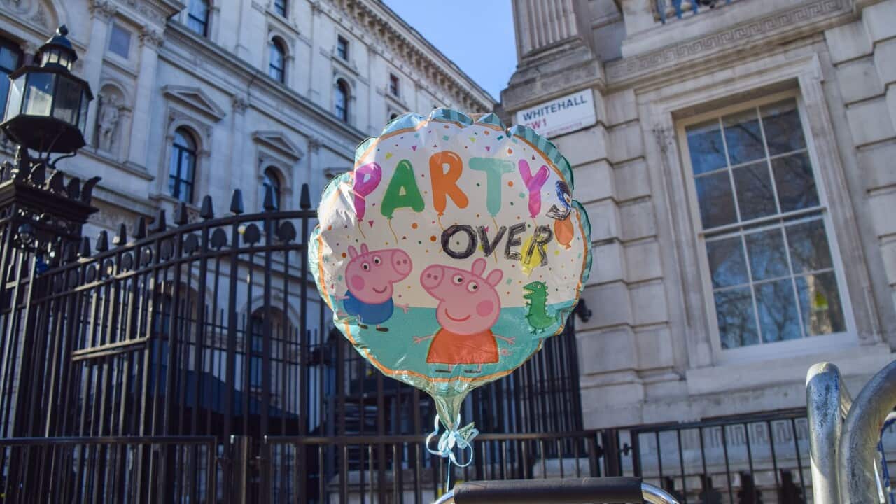 'Party's Over' balloon is seen during the protest outside Downing Street.