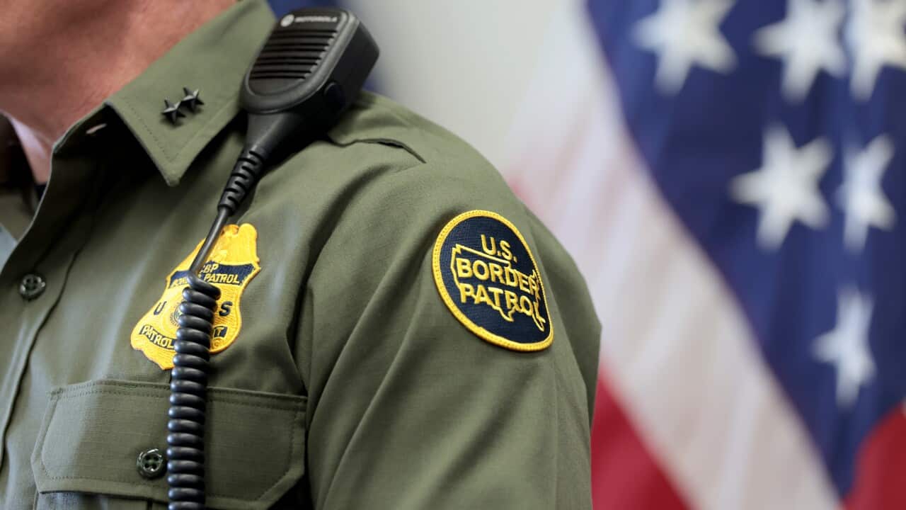 A close-up of the uniform of a US border patrol agent.