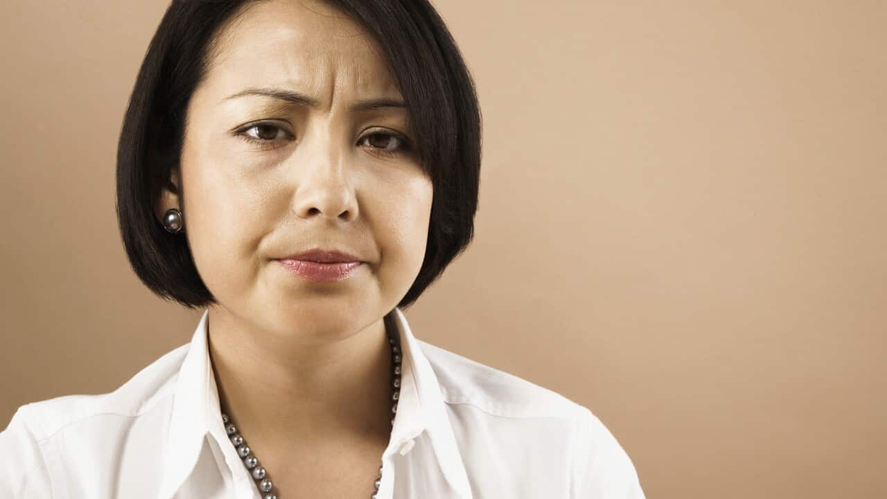 Businesswoman frowning