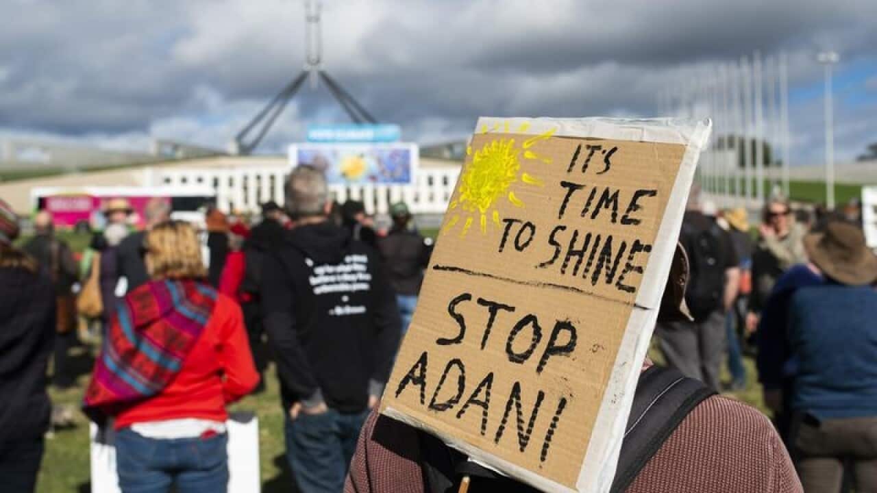 Anti-Adani protesters outside Parliament House in Canberra