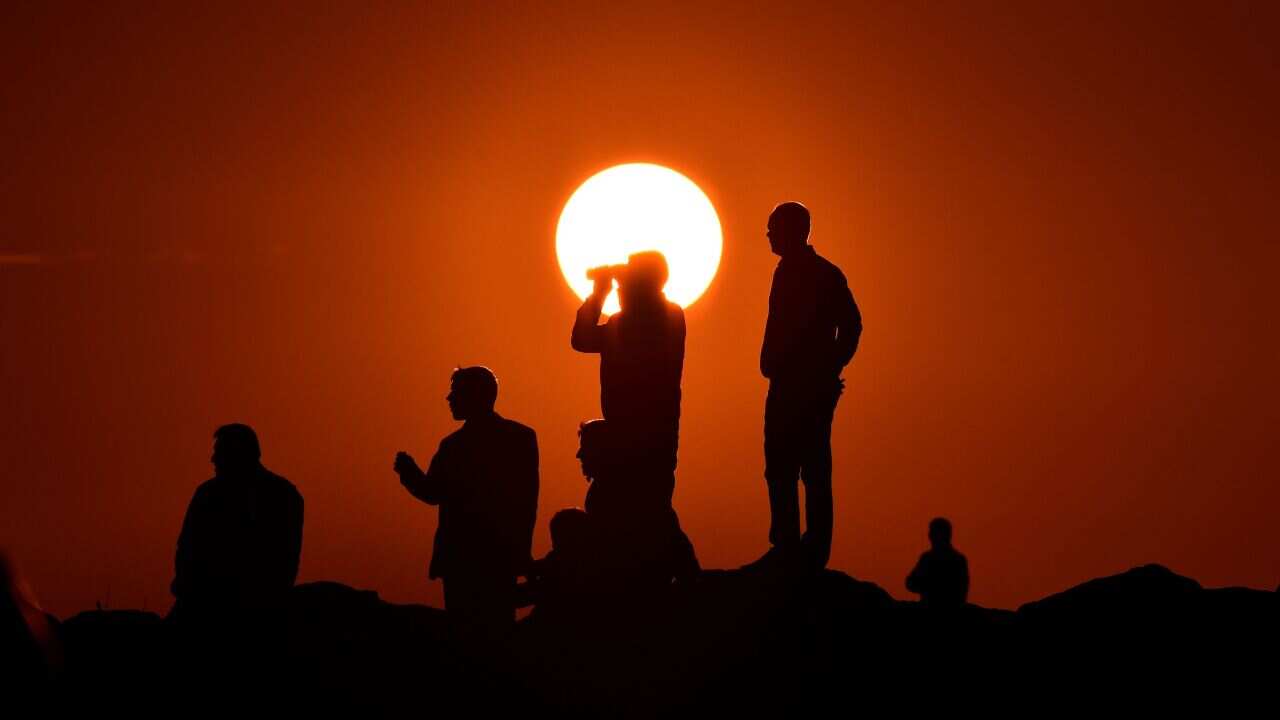 Kurdish people watch Kobani