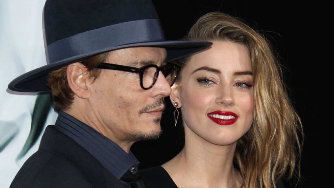 Johnny Depp and Amber Heard at the premiere of "3 Days to Kill" in LA