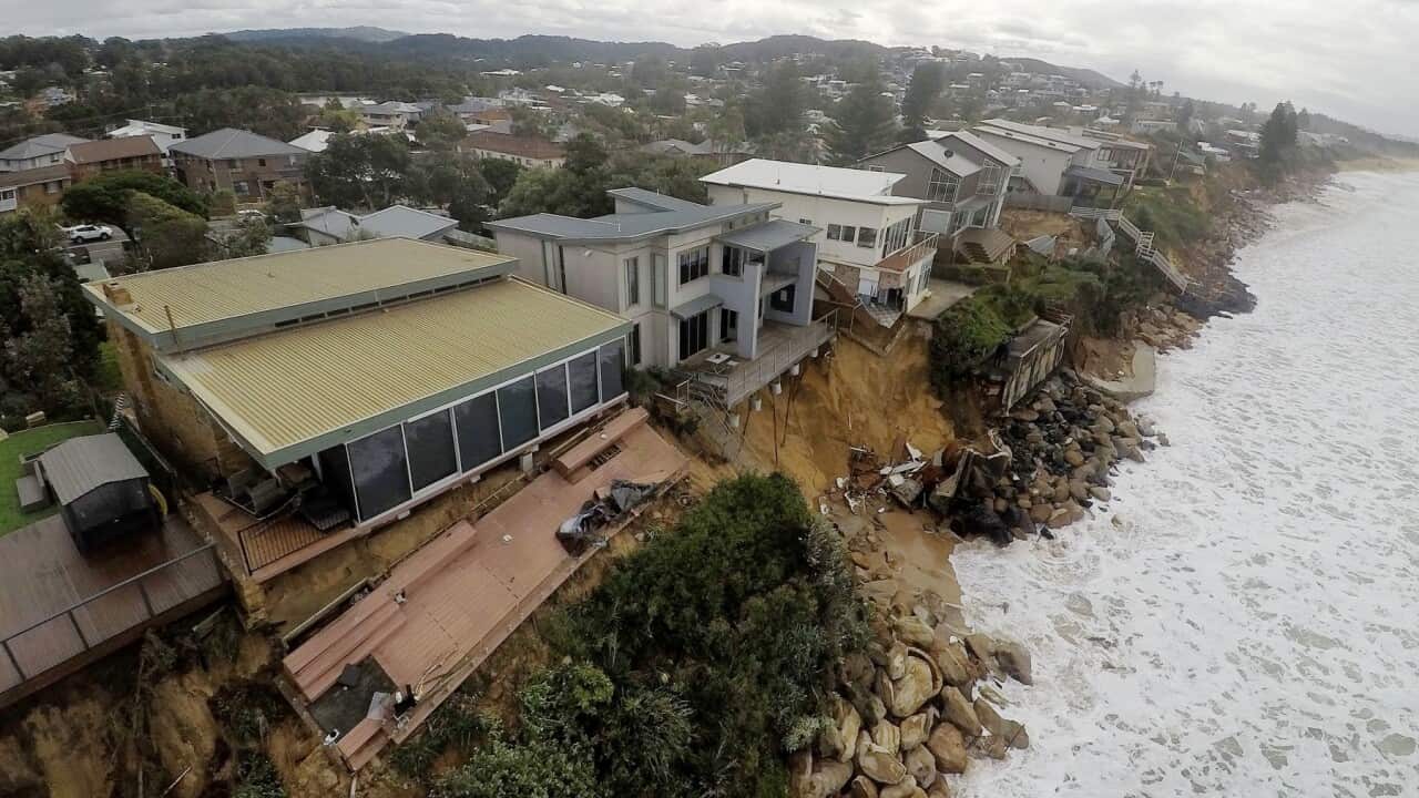 Coastal erosion is seen from the air at Terrigal Beach, on the NSW Central Coast, Saturday, May 16, 2015. Residents living along the NSW coast are on edge after days of extreme surf have caused significant erosion leaving homes exposed to the elements. (A