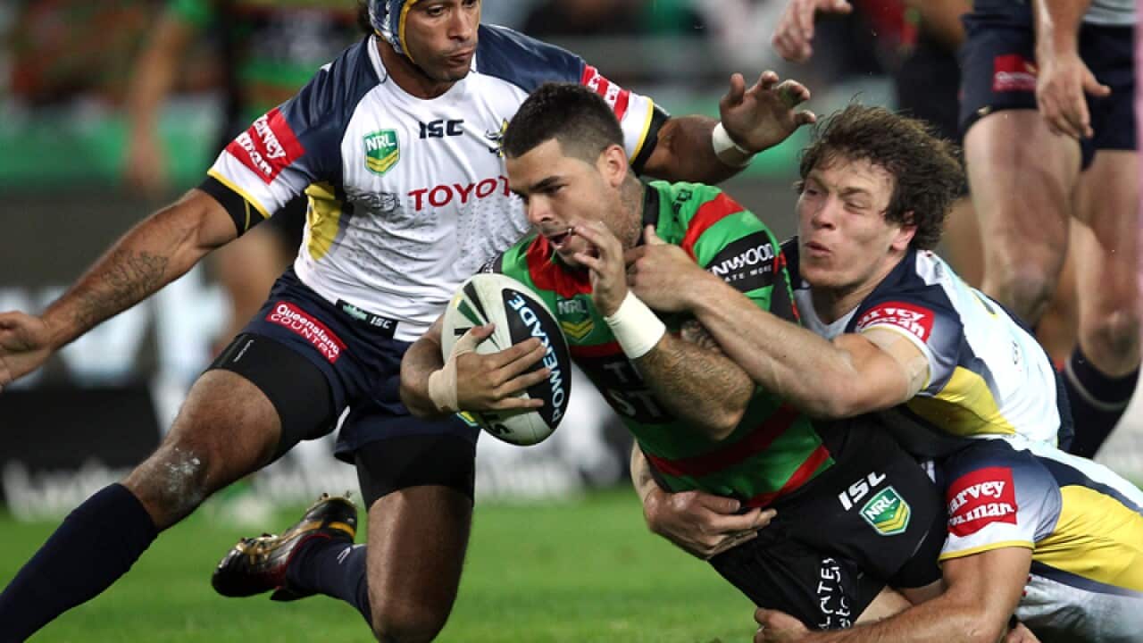Adam Reynolds is stopped short of the try line by Johnathan Thurston