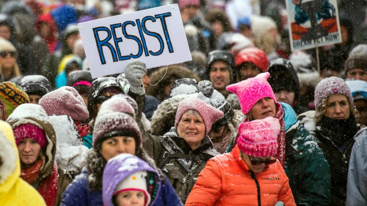 People gather during the Respect Women's March