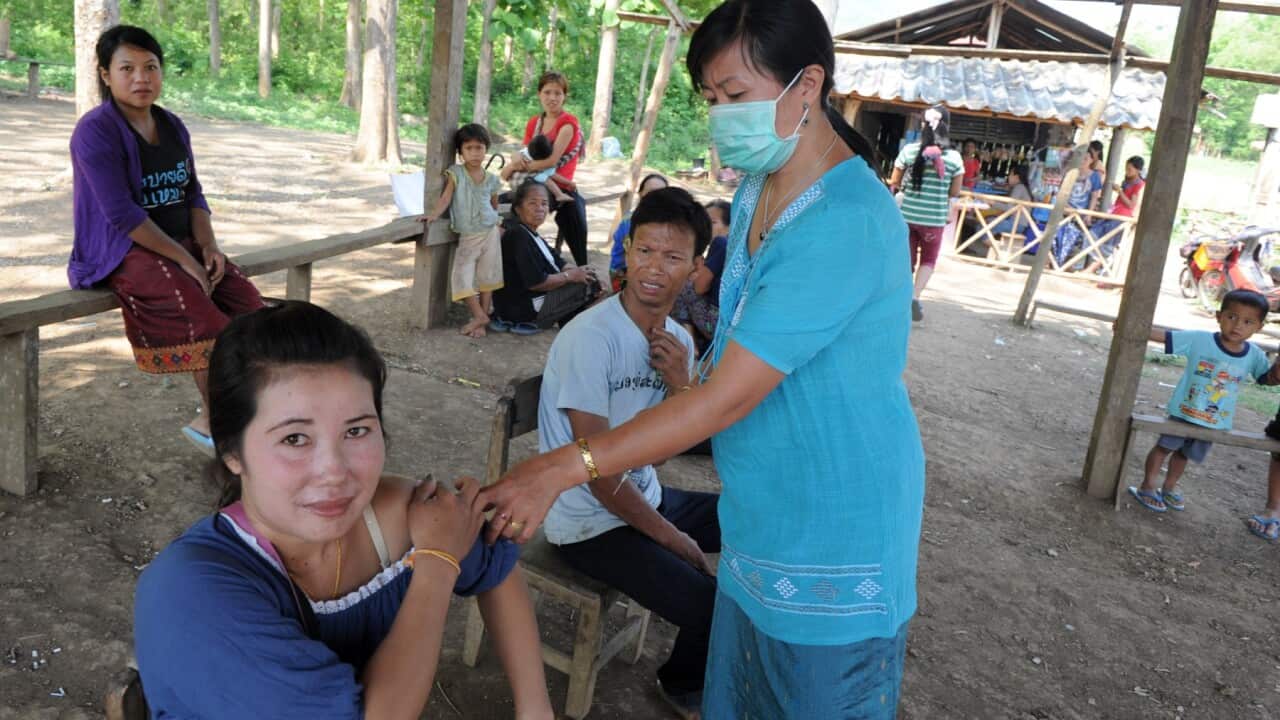 A Laotian villager receives a vaccination shot at a village in Luang Prabang on May 4, 2012 (ROSLAN RAHMANAFP - GettyImages)