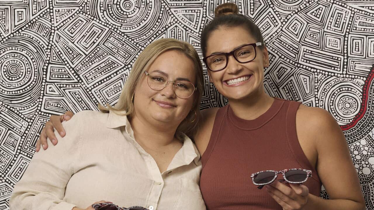 Tarisse (Left) and Sarrita (Right) King in front of their artwork for Specsavers' program with Fred Hollows Foundation