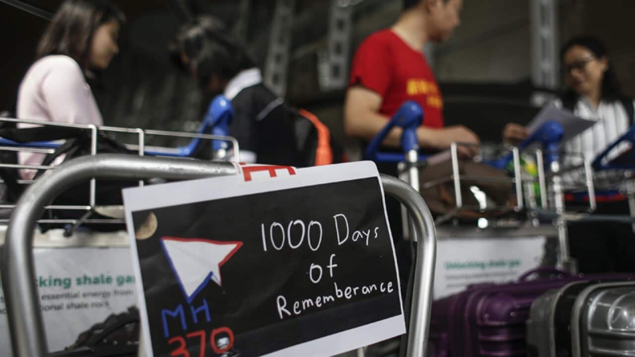 A poster 1000 days since the disappearance of flight MH370