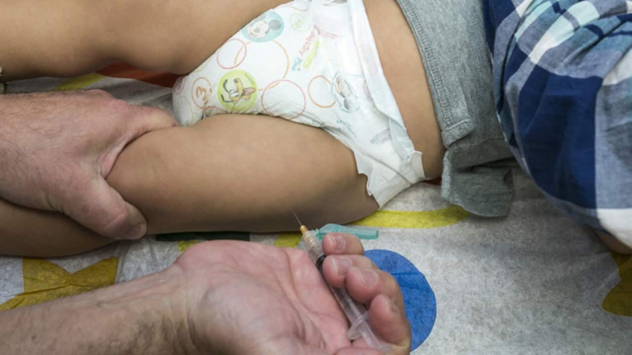 A child is vaccinated