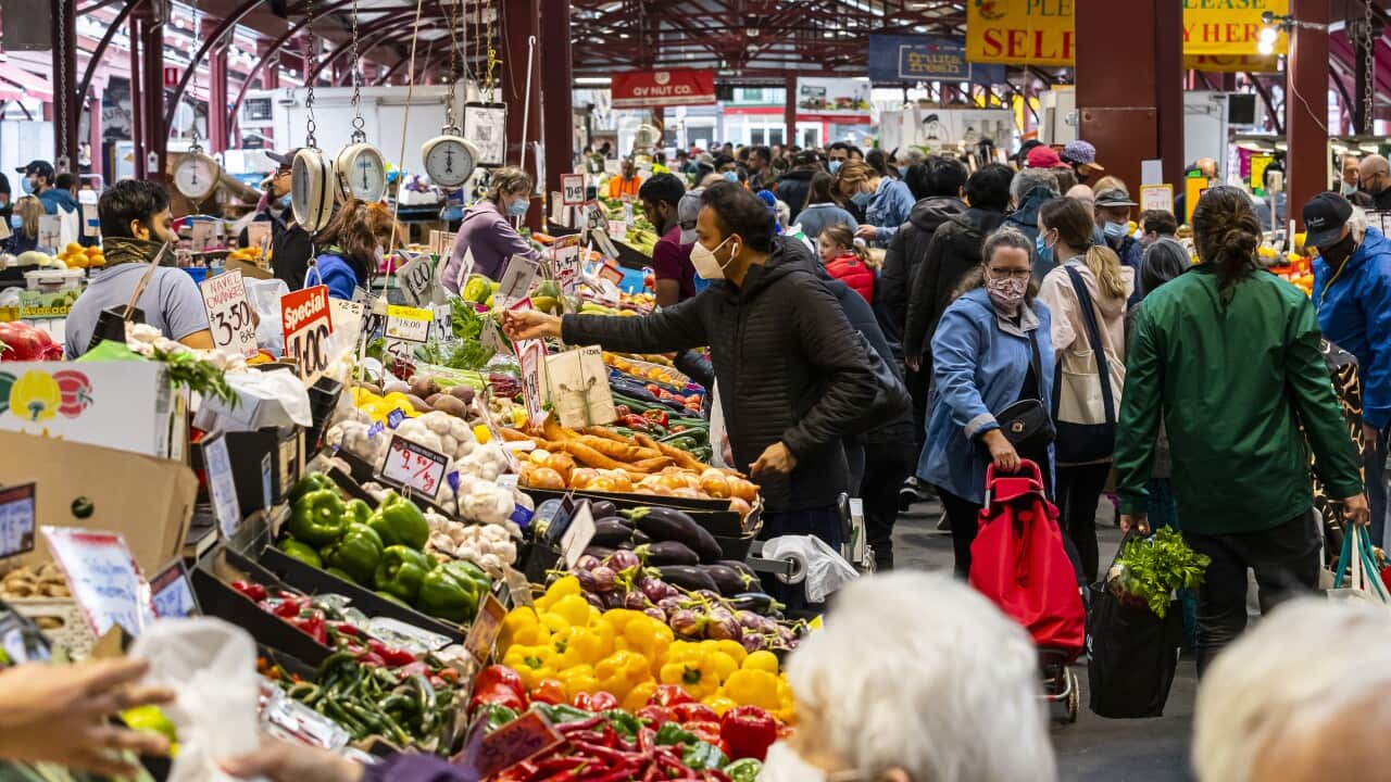 Customers are seen at the Queen Victoria Market in Melbourne, Saturday, October 23, 2021