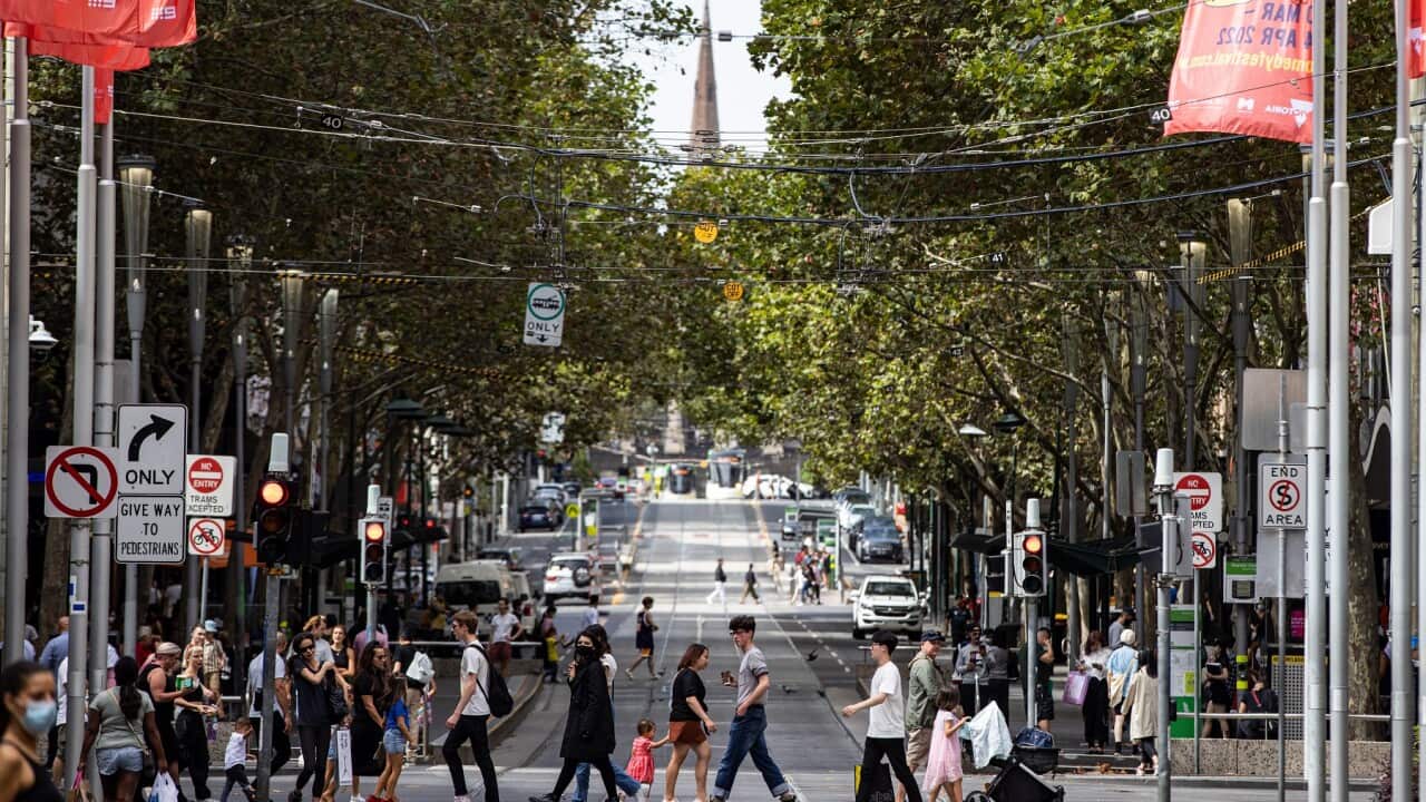 People cross Bourke Street Mall in Melbourne, Sunday, March 20, 2022. (AAP Image/Diego Fedele) NO ARCHIVING