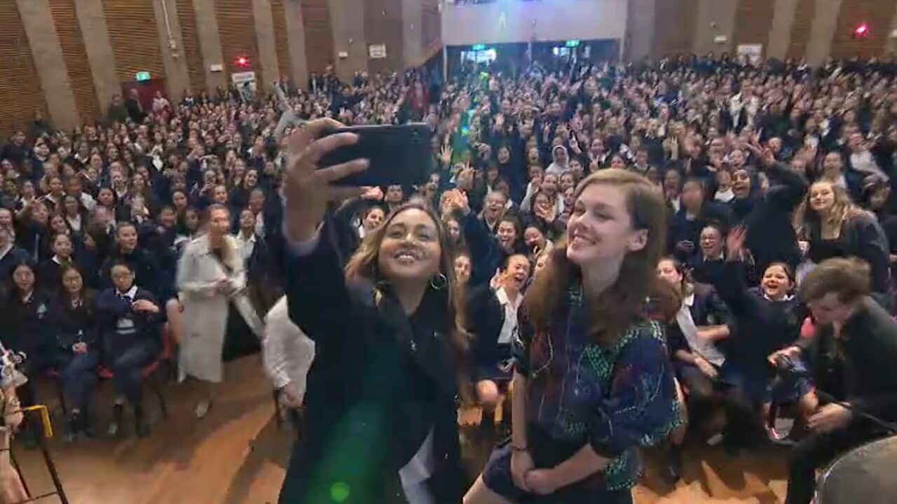 Artist Jessica Mauboy with Burwood Girls High School competition winners.