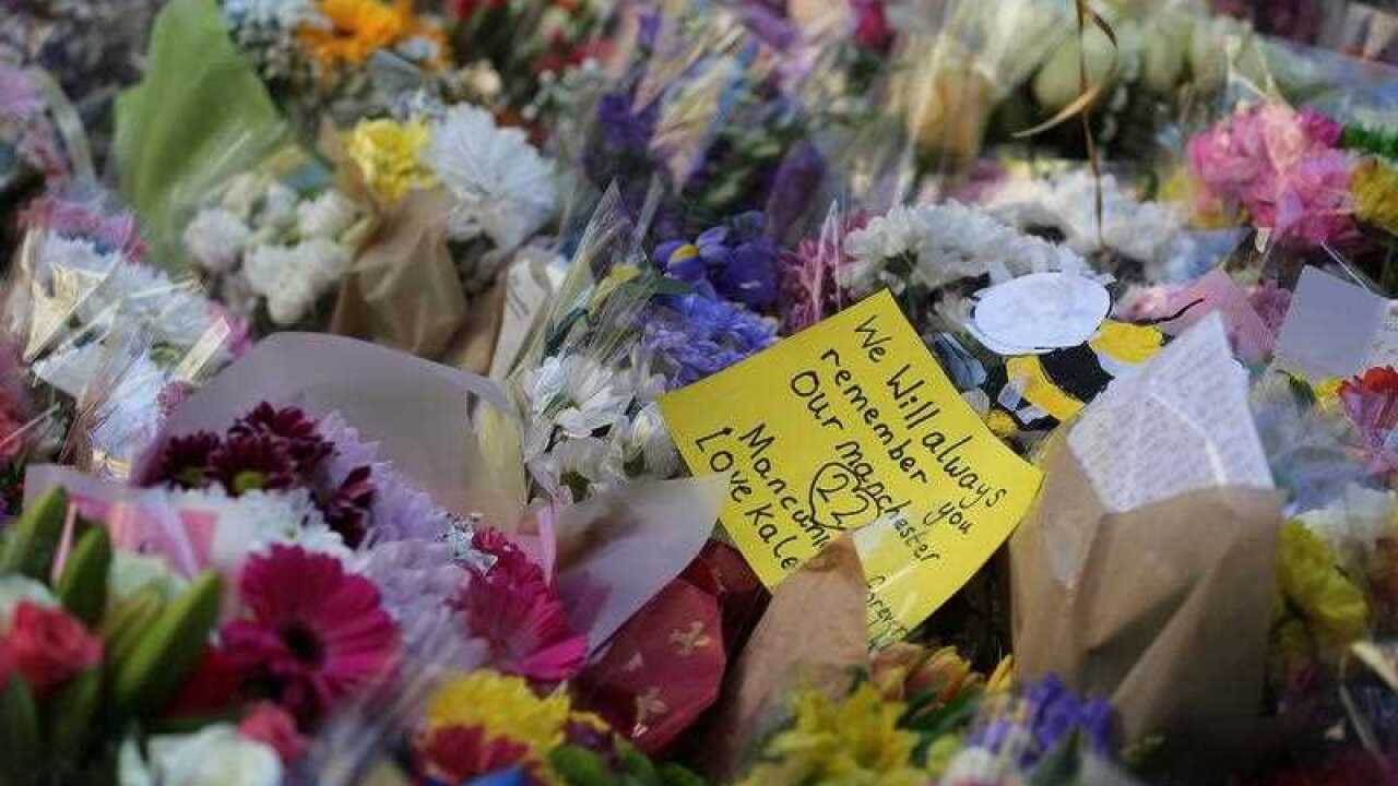 Flowers left by people as they pay their respects in St Annes Square on the 1st anniversary of the Manchester Arena bombing, in Manchester, Britain, 22 May 2018. 