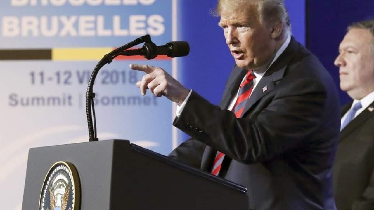 US President Donald Trump speaks during a press conference in Belgium.