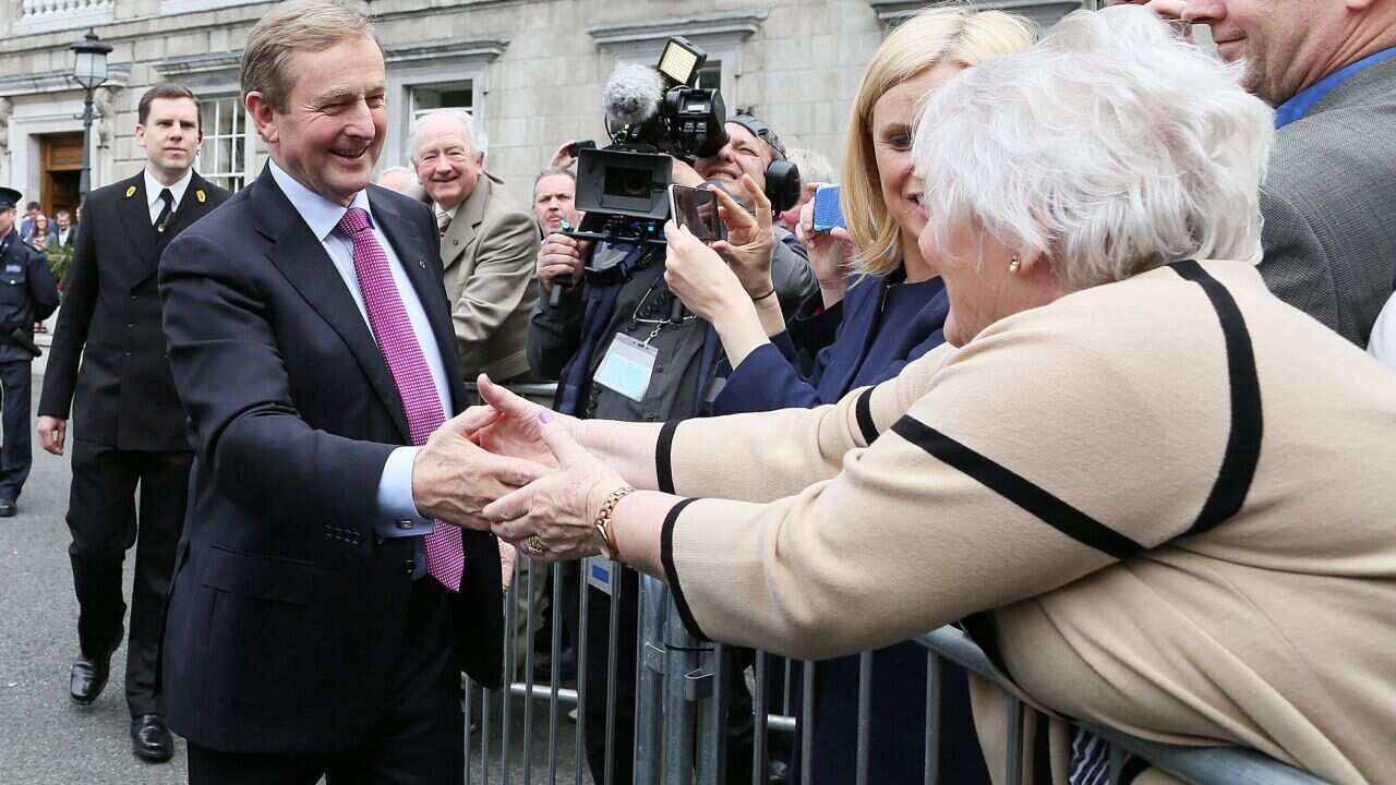 Newly elected Prime Minister Enda Kenny greets supporters