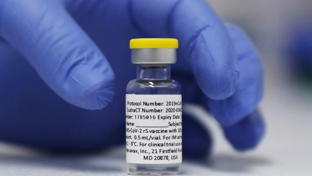FILE - In this Wednesday, Oct. 7, 2020, file photo, a vial of the Phase 3 Novavax coronavirus vaccine is seen ready for use in the trial at St. George's University hospital in London. Novavax says its vaccine appears effective against COVID-19 in a large