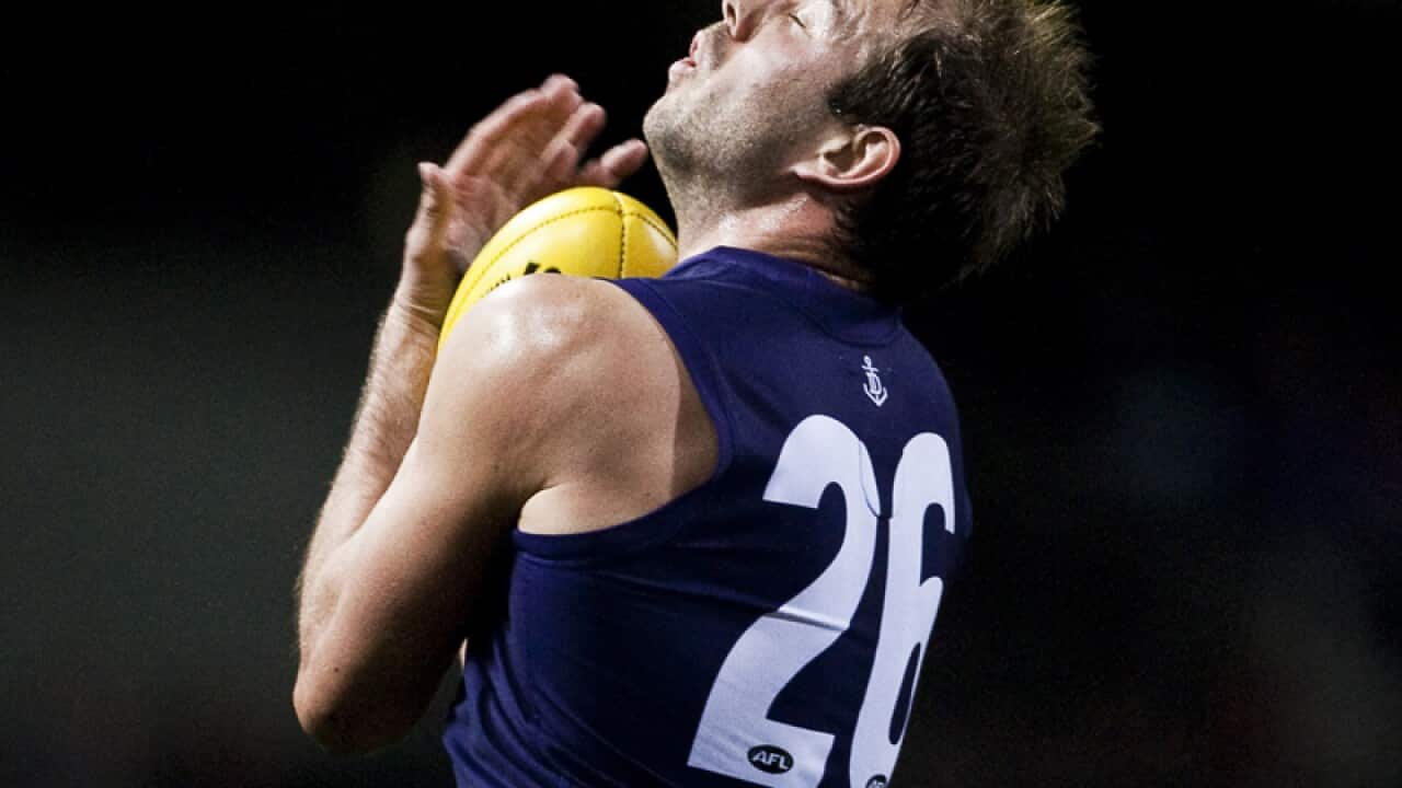 Fremantle's Kepler Bradley takes a mark.