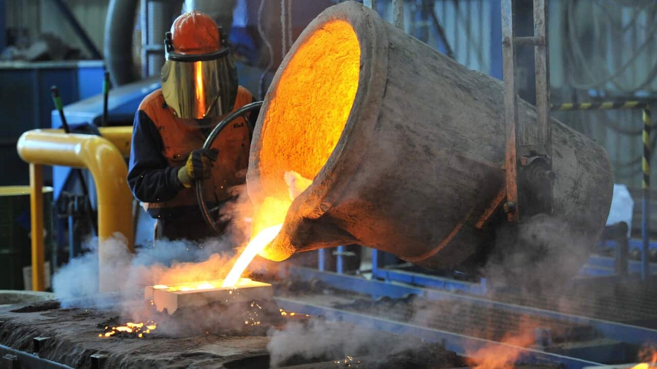 A factory worker pours molten iron at Backwell IXL in Geelong in Geelong, Wednesday, April 30, 2014. (AAP Image/Julian Smith) NO ARCHIVING
