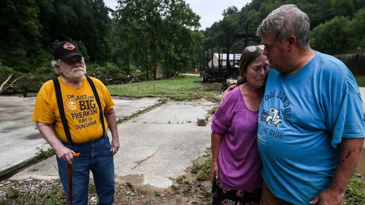 A man comforting a woman