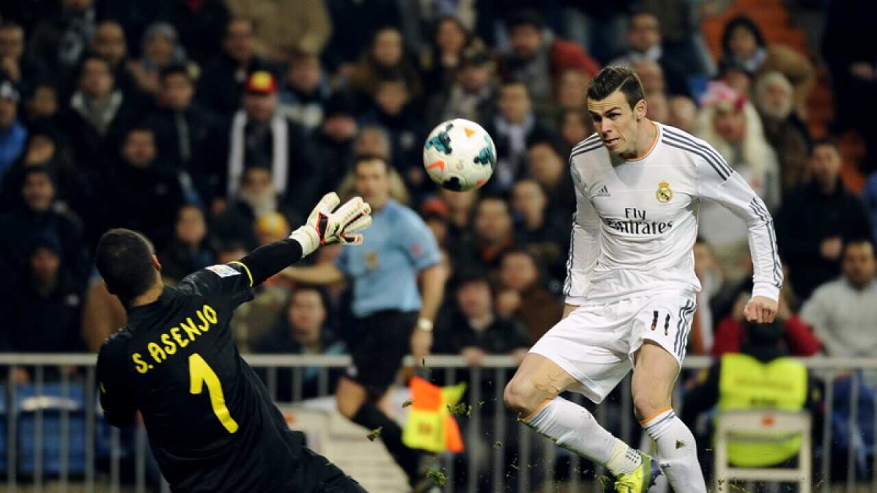 Gareth Bale (R) in action