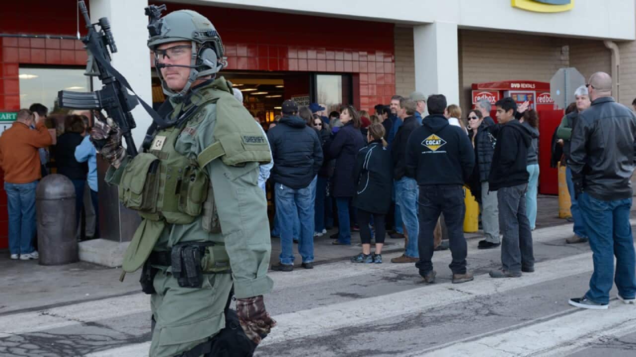 An Arapahoe County Sheriff patrols after a school shooting.