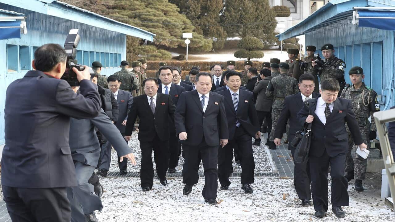 The head of North Korean delegation Ri Son Gwon, center, arrives at the Panmunjom in the Demilitarized Zone in Paju, South Korea.