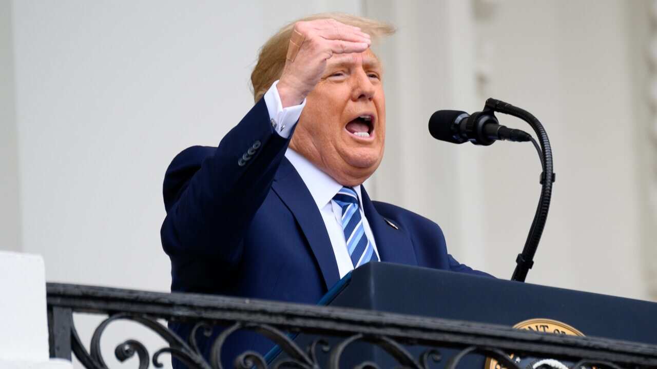 Trump's hand while speaking from the Truman Balcony of the White House in Washington, DC, USA, on 10 October 2020.