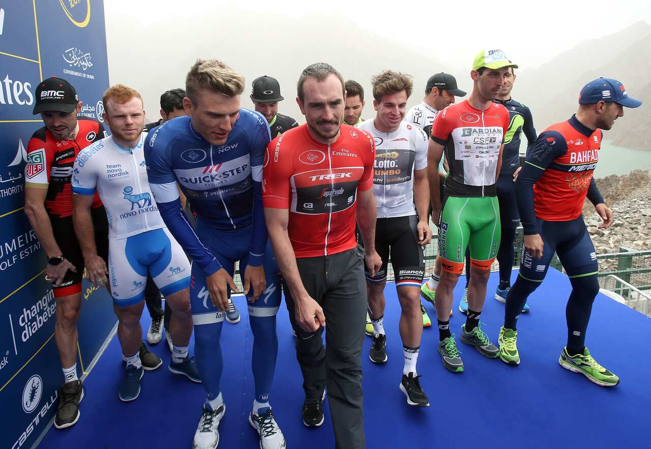 The peloton react on the podium of the  4th stage of the Dubai Tour  2017 cycling race, the The Westing  stage of 200km. The race was canceled for to much. wind. United Arab Emirates, 3 February  2017.ANSA / MATTEO BAZZI