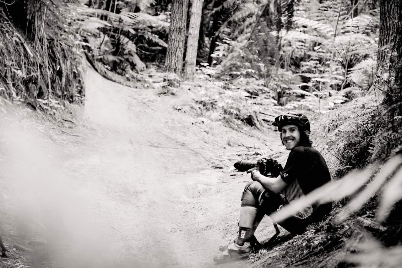 Photographer, Paris Gore, waits on the trails for the perfect light.
