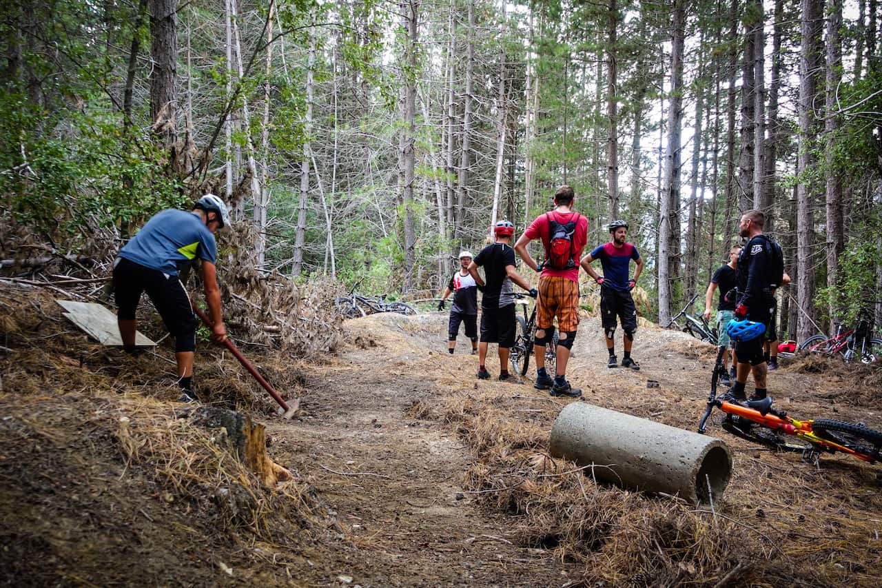 A detour on the way out saw the crew restore an old pump track. Many feet made light work of the pine needles covering the trails (Kath Bicknell)