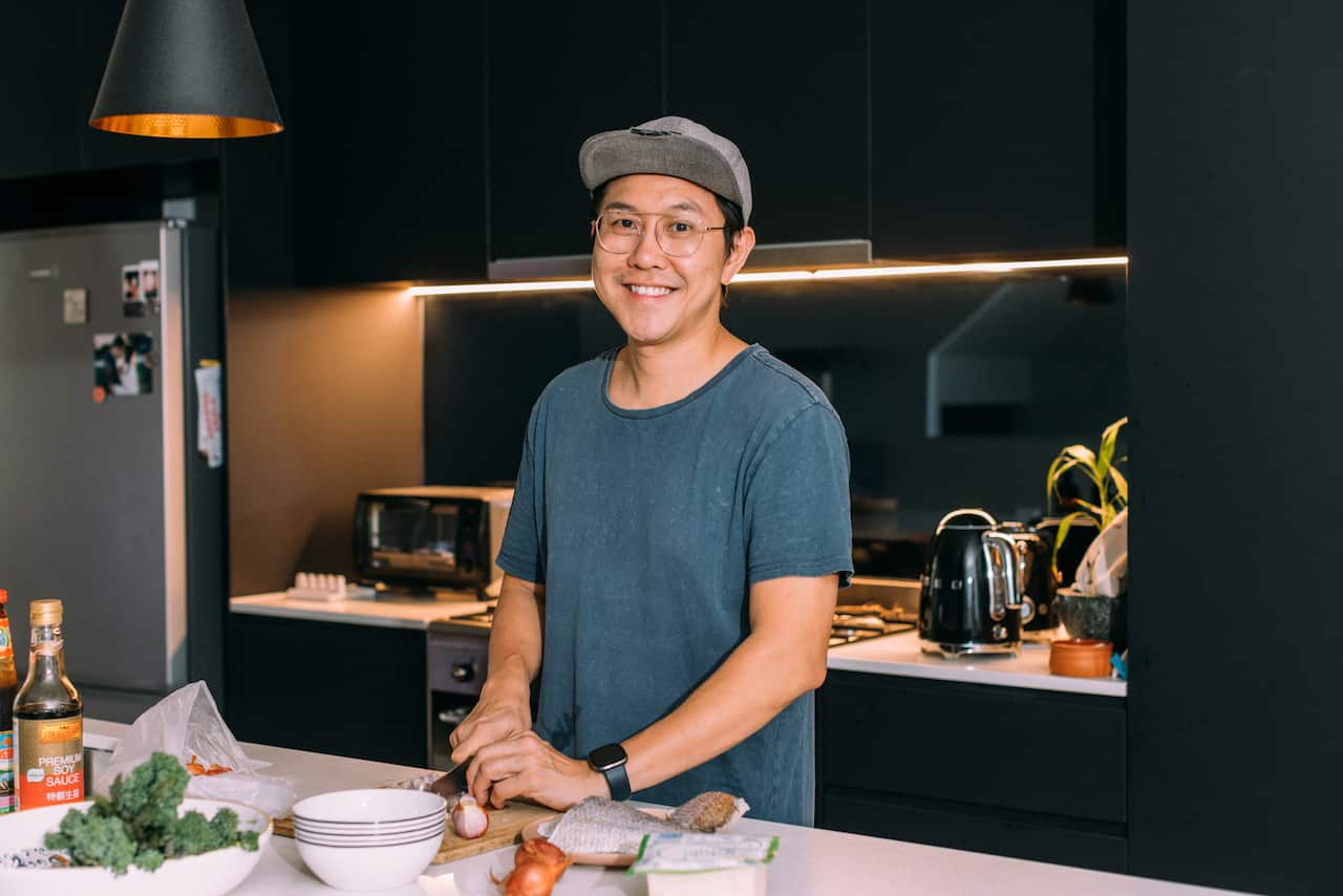 John Puah cooking his po po's shallot braised chicken.