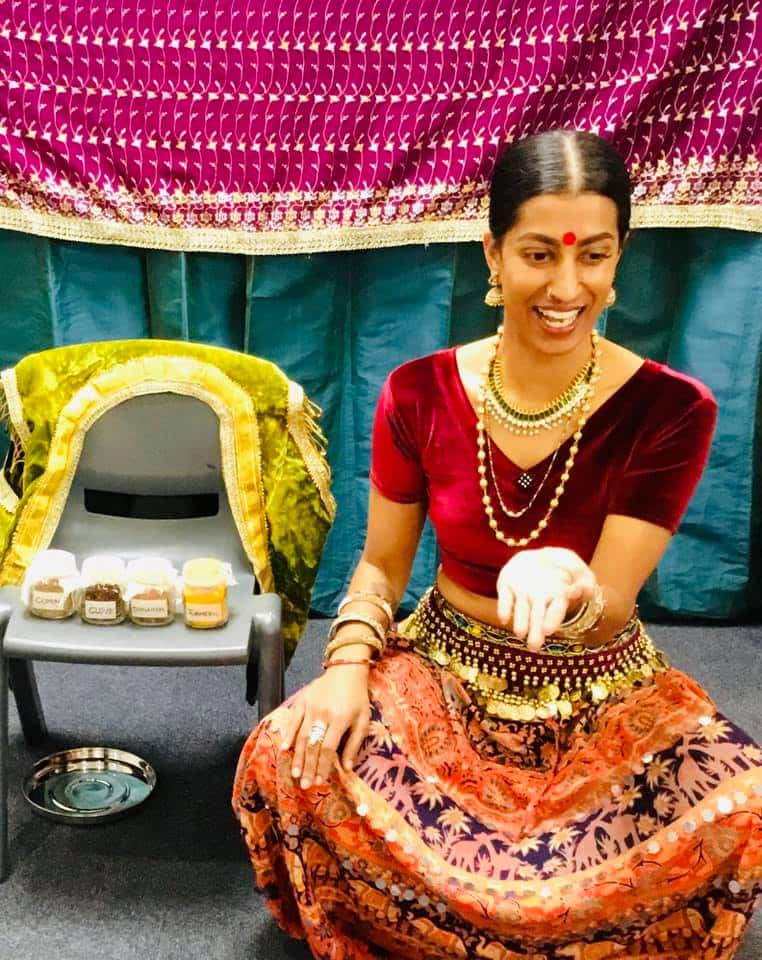 Shyamla Eswaran with her spice tin, as she teaches children about cultural acceptance with food.
