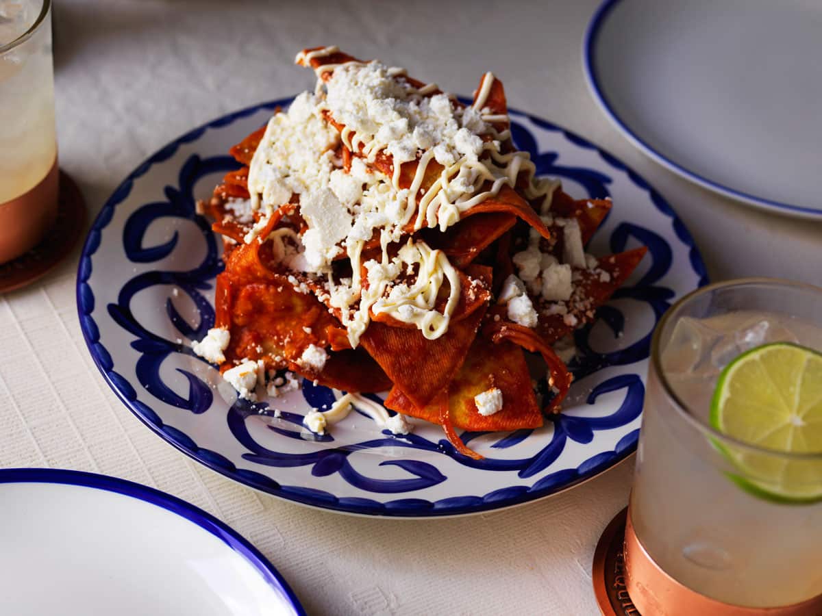 Chilaquiles are red salsa-drowned corn chips and cheese.
