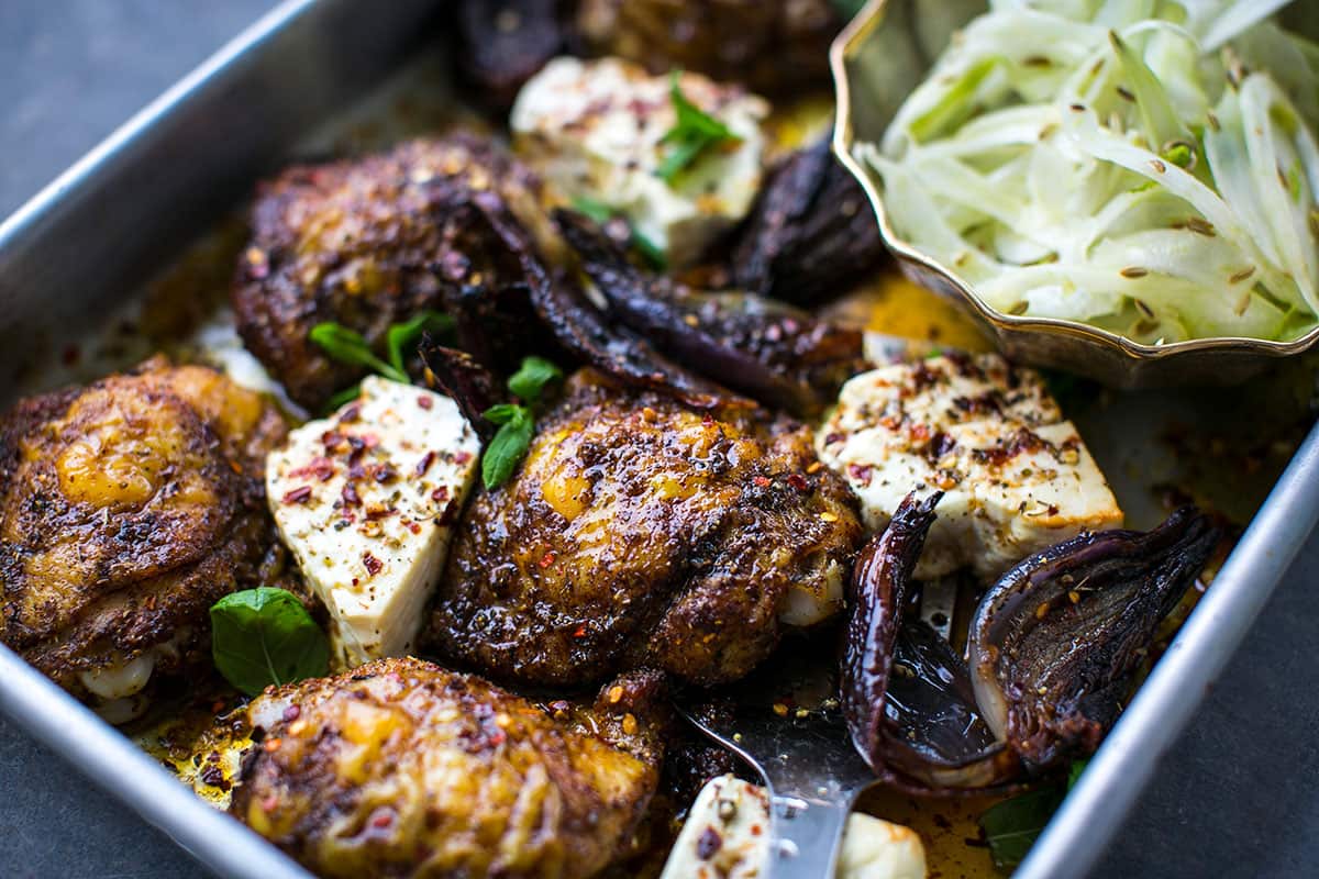 Ras el hanout chicken thighs with baked feta and shaved fennel