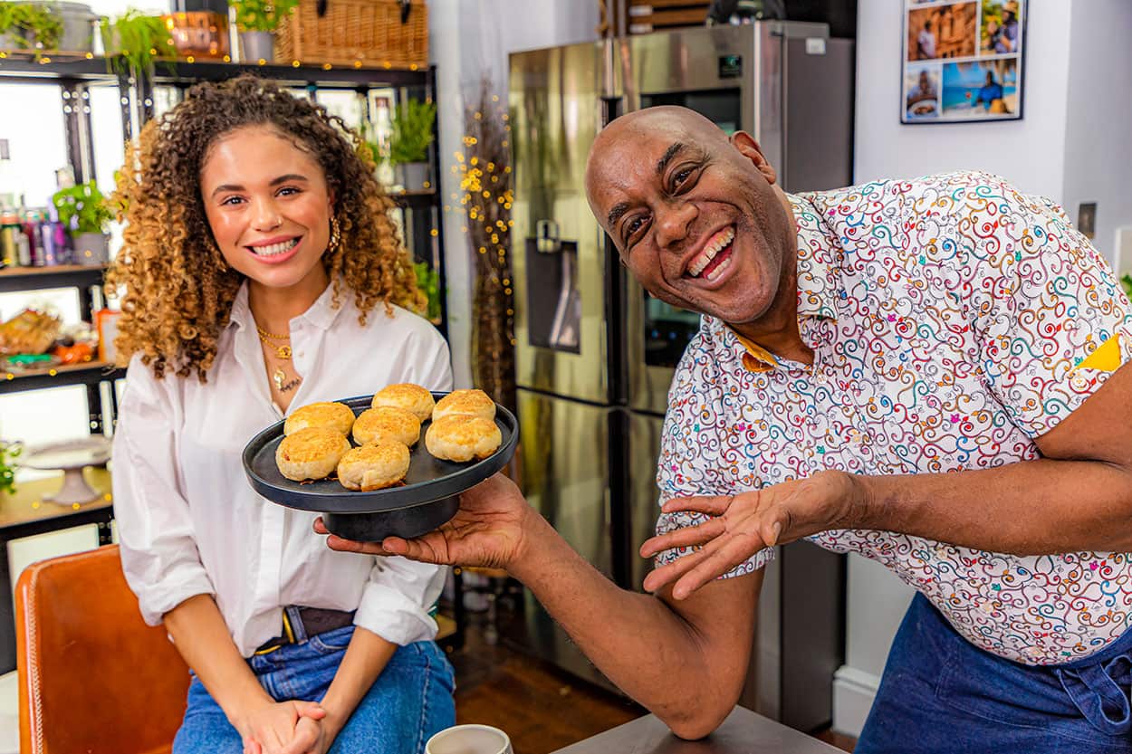 Jessic Plummer and Ainsley Harriot with eccles cakes