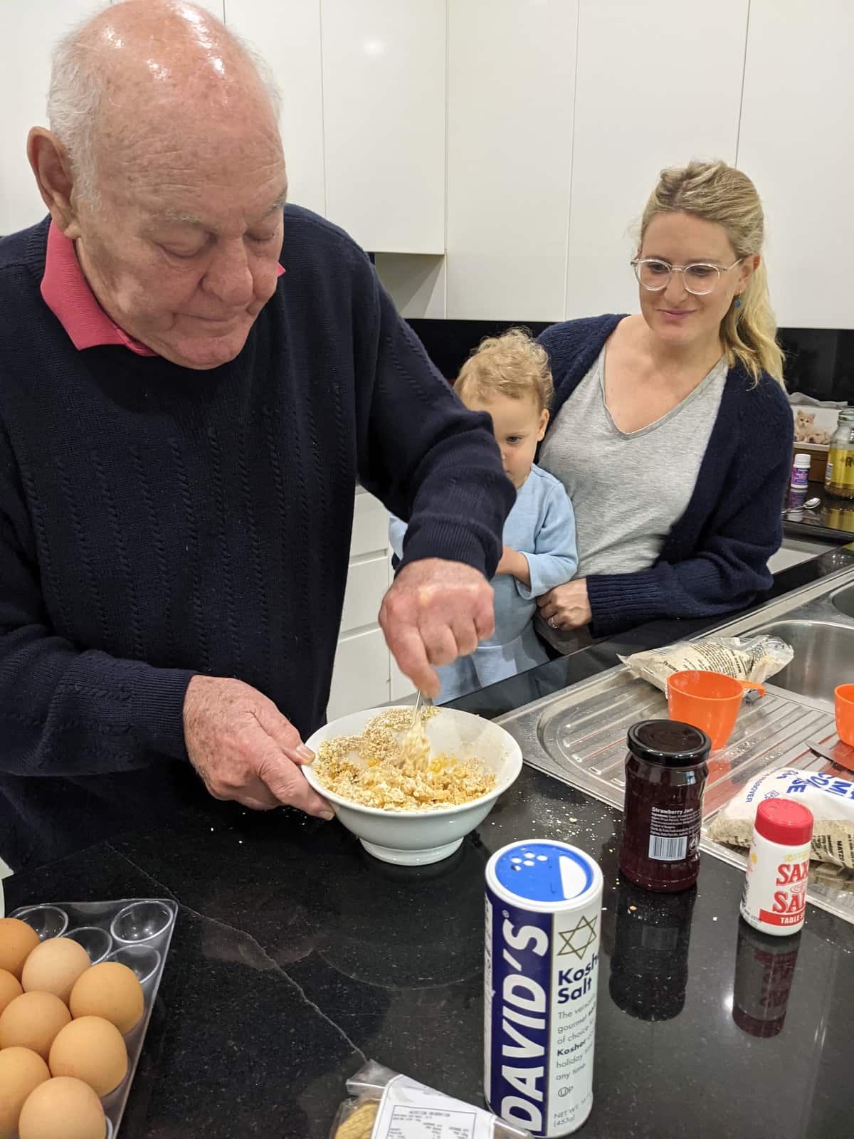 Victoria's grandpa making pancakes.