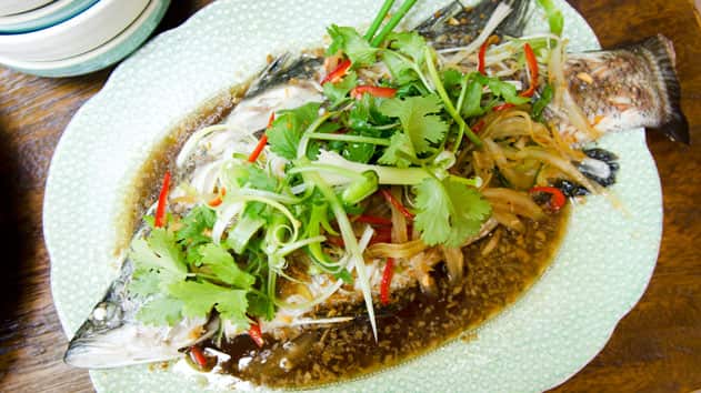 Steamed whole barramundi with ginger and shallot sauce