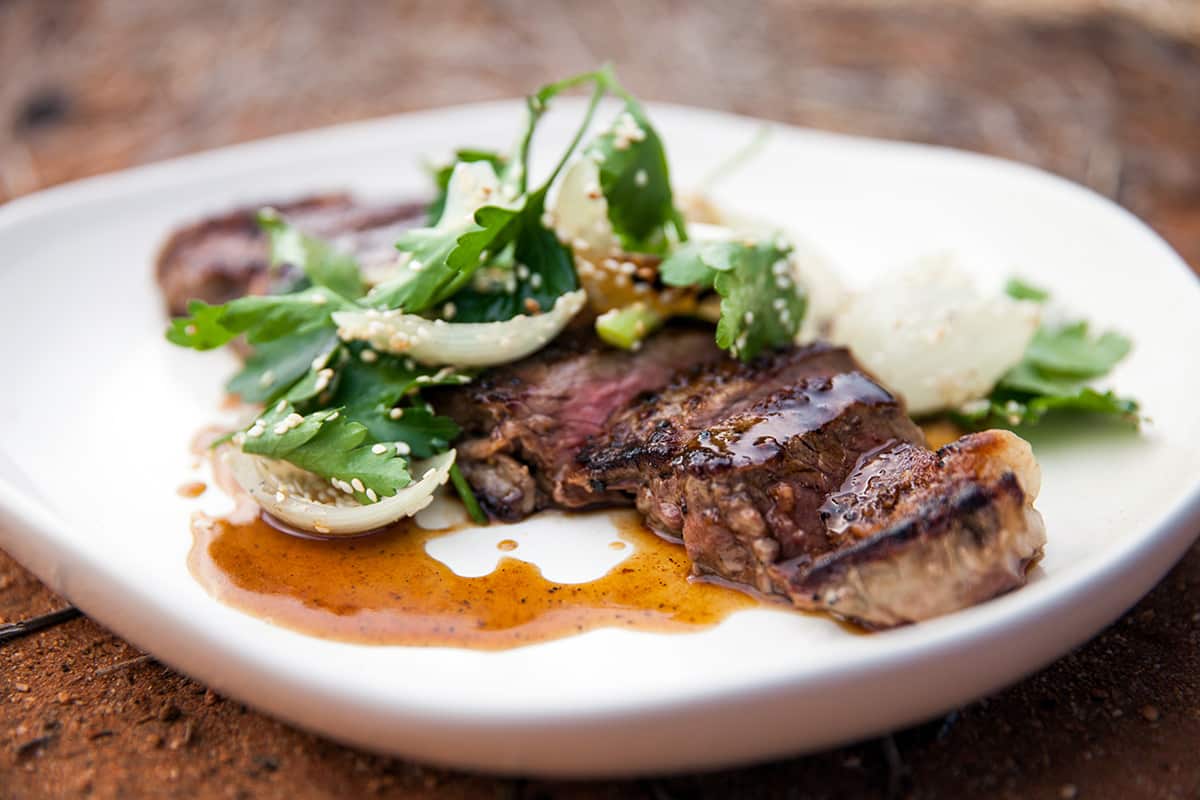 Steak with pepperberry, honey and soy