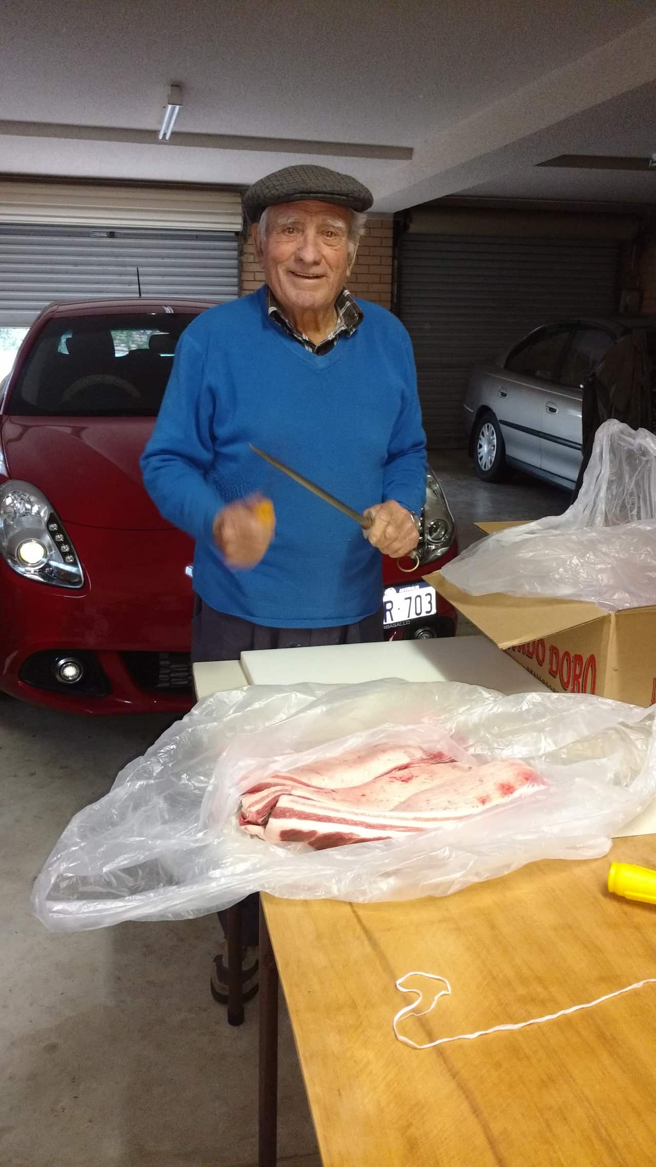 Old photo of Nonno Carmine Mercadante sharpening his knife skills