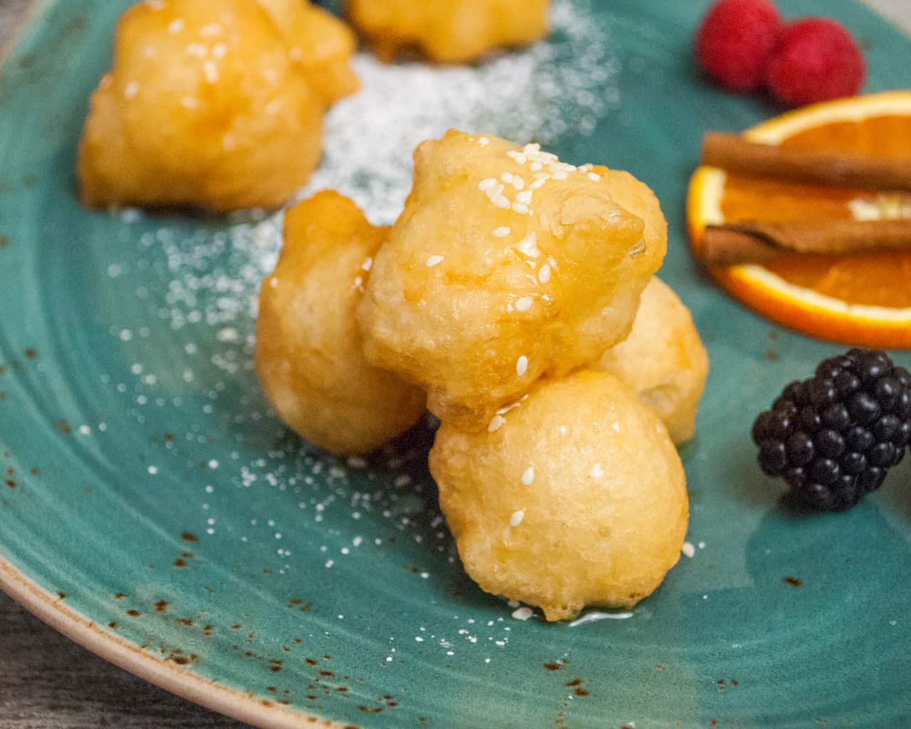 Fried dough balls in honey