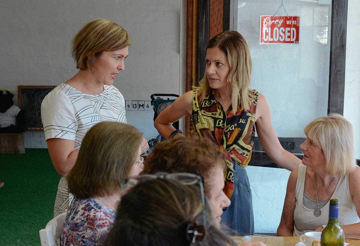 Suni Stolic, left and Zoe Papadopoulos, standing right, at a Melbourne Grandmas event.