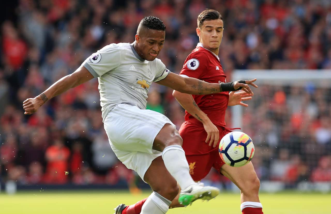 Manchester United's Antonio Valencia and Liverpool's Philippe Coutinho battle for the ball during the Premier League match at Anfield, Liverpool in 2017.