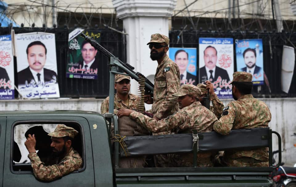 Tense scenes as Pakistani soldiers patrol as voters go to the polls.