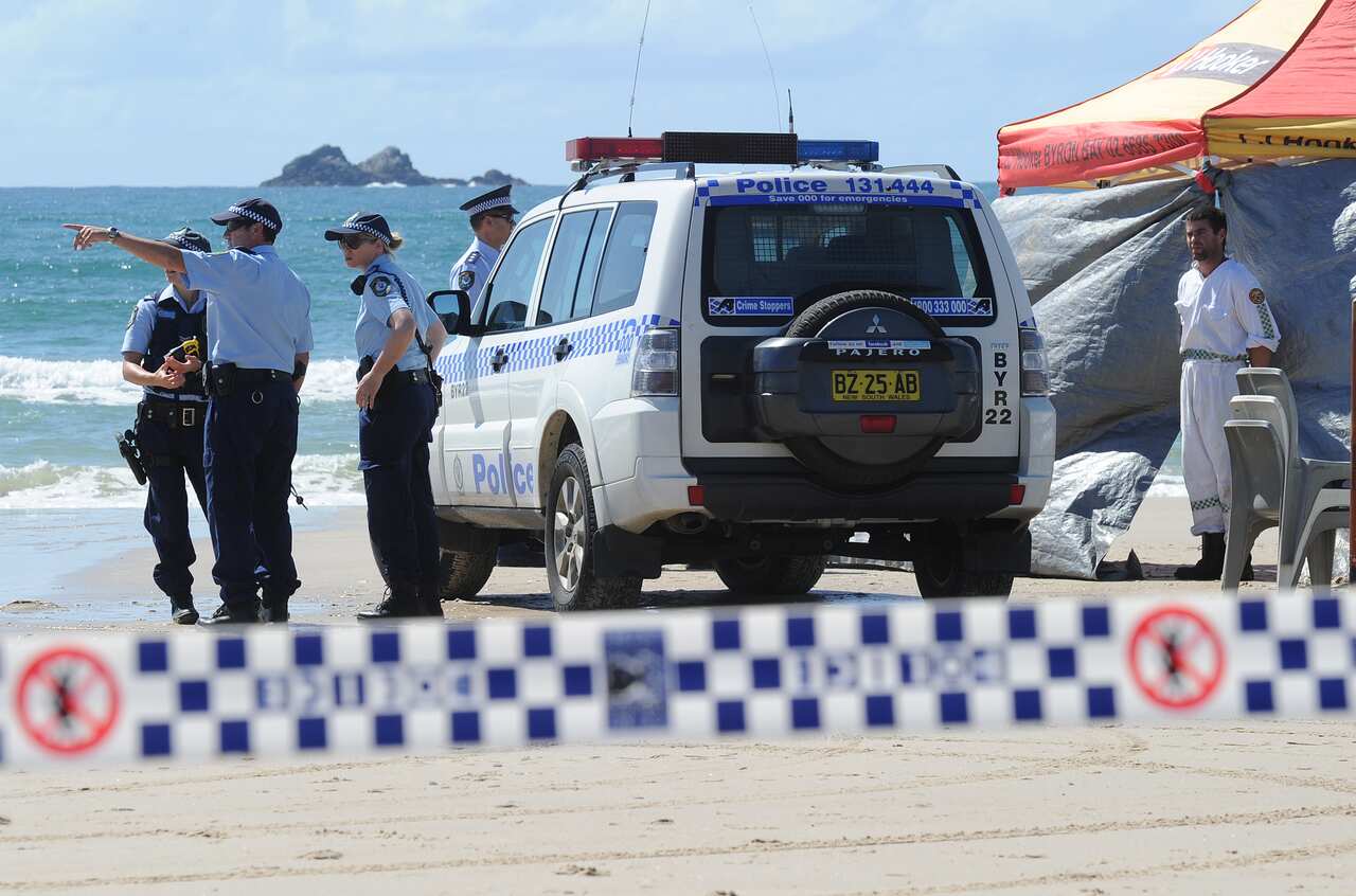 Emergency services attend Clarkes Beach at Byron Bay in far northern New South Wales, Tuesday, Sept. 9, 2014. A man in his 40s has died following a shark attack while swimming at Clarkes Beach this morning. (AAP)