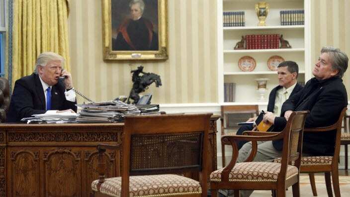 President Donald Trump speaks on the phone with Prime Minister of Australia Malcolm Turnbull, with then-National Security Adviser Michael Flynn, center, and then- chief strategist Steve Bannon, right, in the Oval Office of the White House in Washington.Pr